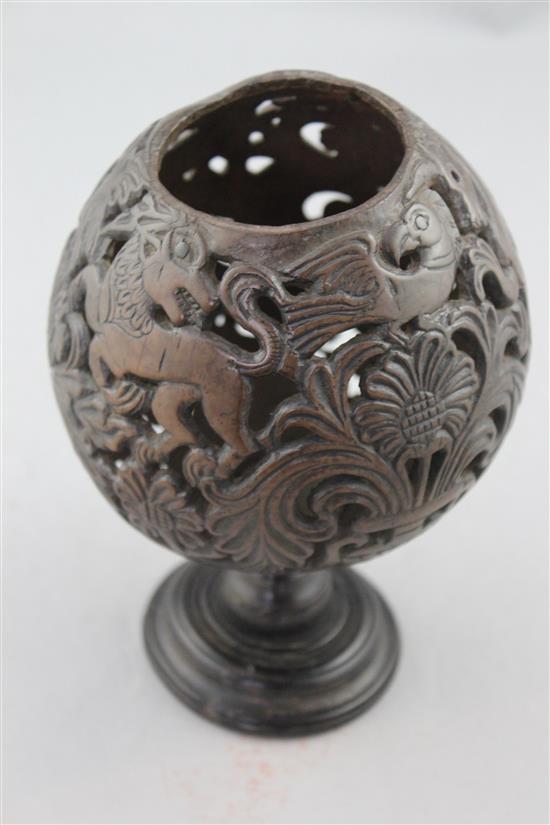 A 19th century carved and pierced coconut cup or goblet, 7.25in.
